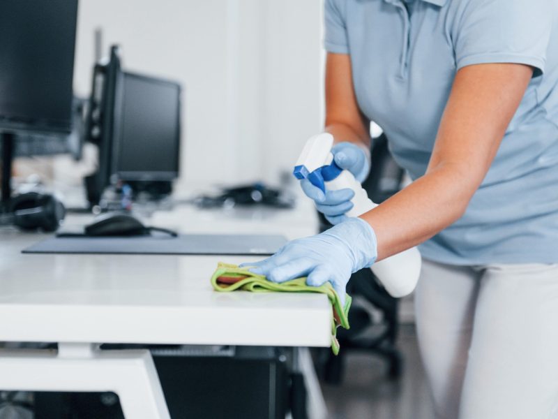 close-up-view-woman-protective-gloves-that-cleaning-tables-office-min